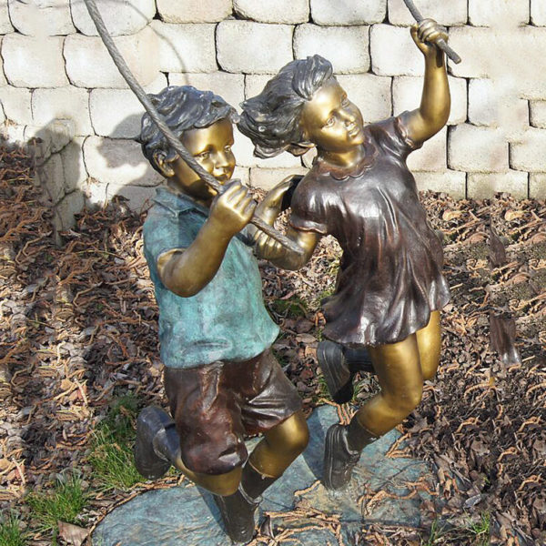 Life size bronze statue of a child skipping rope