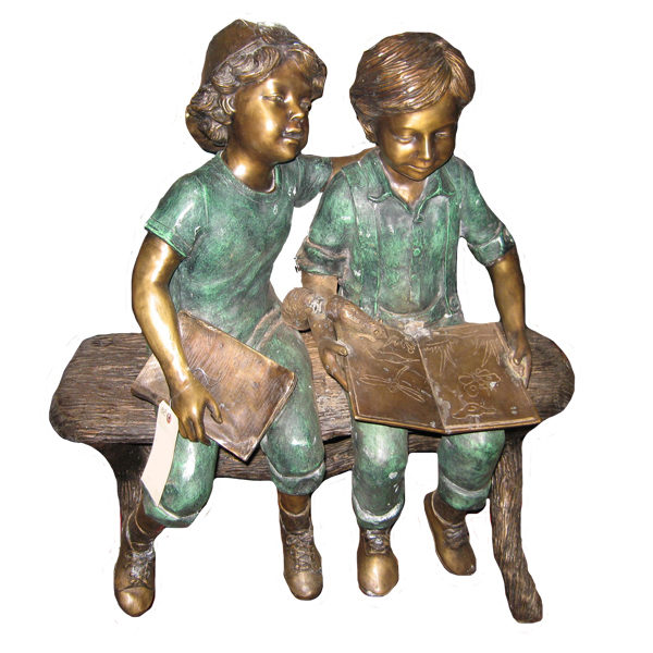 Bronze statue of boy and girl reading a book