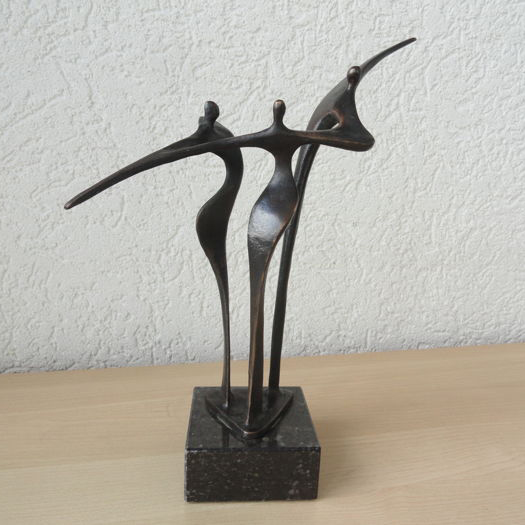 Bronze sculpture of a dancing abstract figure