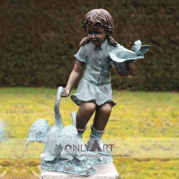 Bronze sculpture of children feeding birds adorns the garden